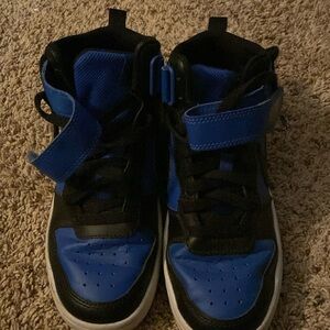 Nike youth size 4.5 black and blue high top with Velcro strap and laces